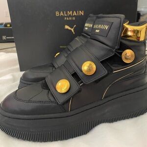 Balmain X Deva straps Cara Delevingne collab